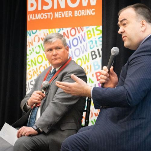 Kieran Jennings & Fritz Kaegi sitting on stage 